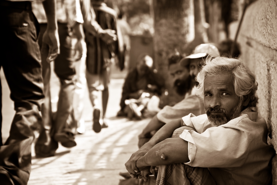 Men_seated_on_the_ground_in_Mylapore,_Chennai,_Tamil_Nadu,_India_-_20080511